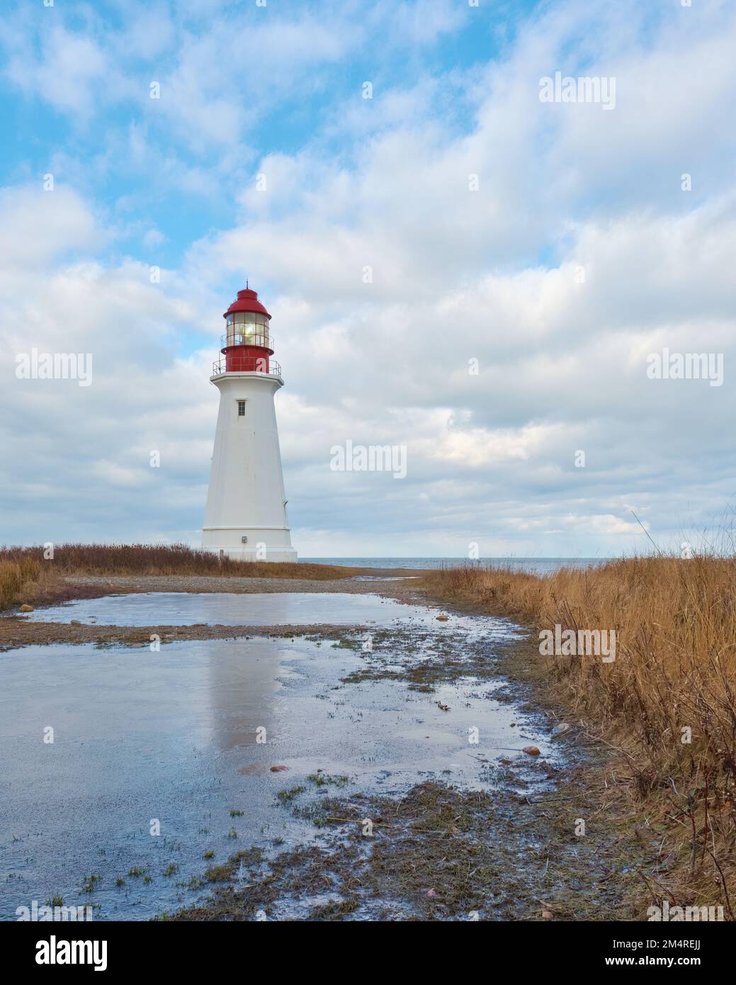 The Low Point Lighthouse is at the entrance to Sydney Harbour near New Victoria Cape Breton Island Nova Scotia. Stock Photo