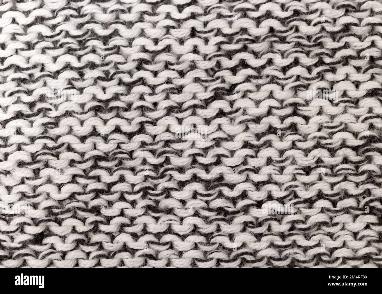grey knitted background, top view Stock Photo