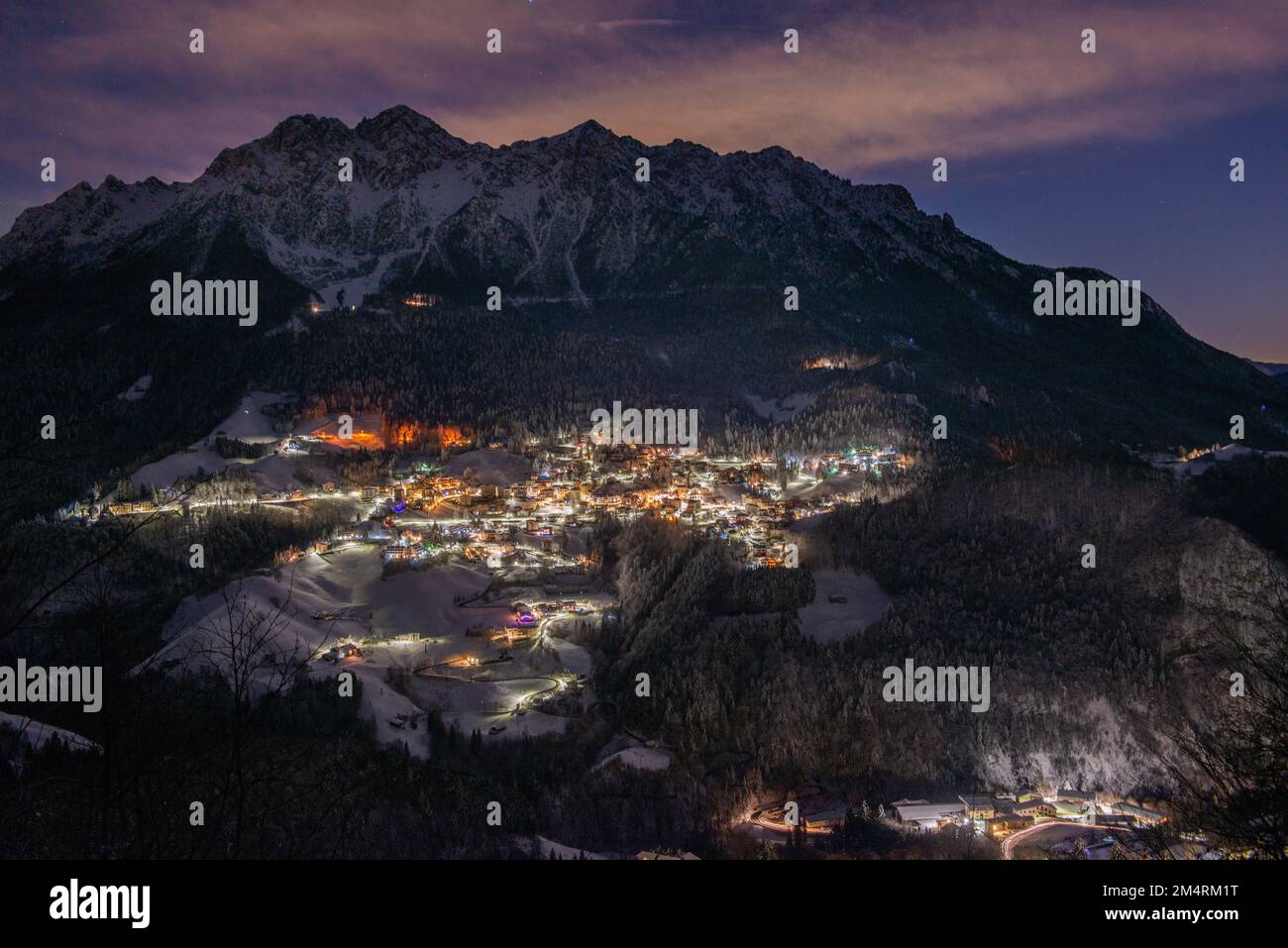 Snowy mountain village at night Stock Photo - Alamy