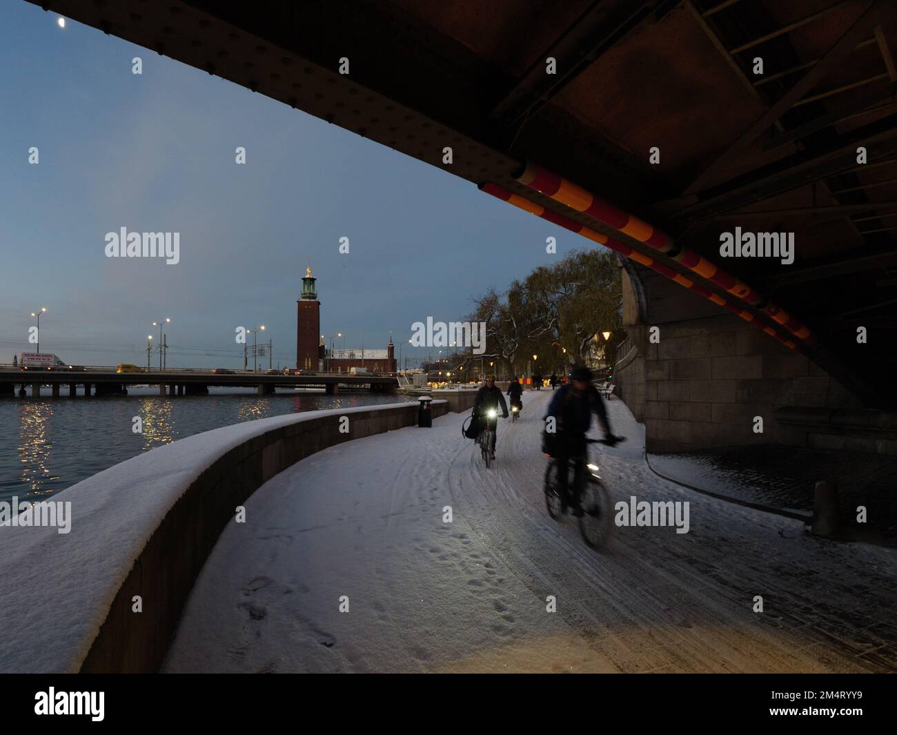 Commuters cycling in Stockholm city center at dawn in winter Stock Photo