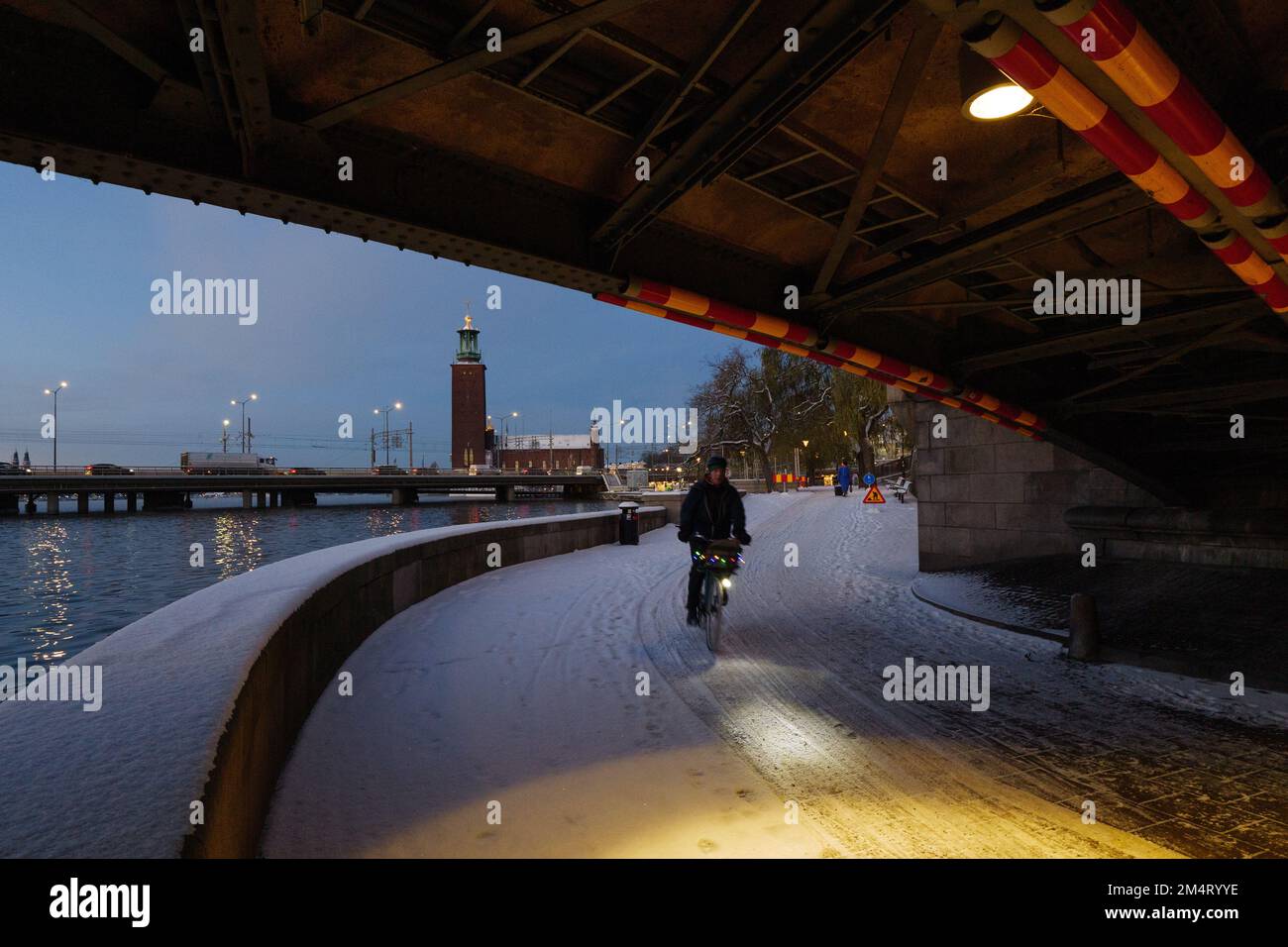 Commuter cycling in Stockholm city center at dawn in winter Stock Photo