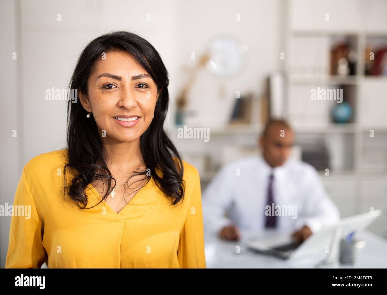 Successful latin american business woman standing in office Stock Photo ...
