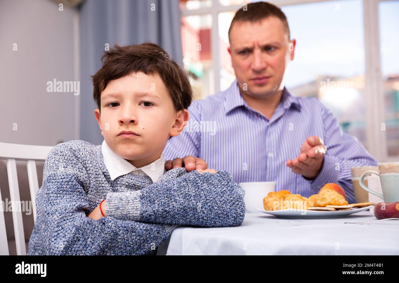 Troubled boy scolded by father Stock Photo - Alamy