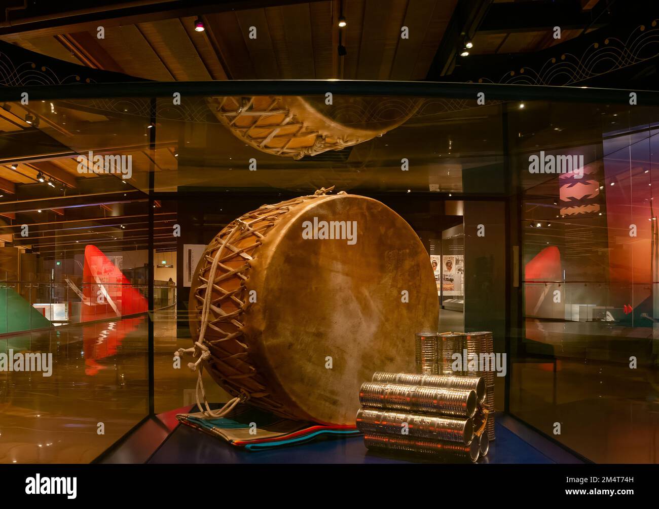 Traditional prairie-style hide drum and modern stomp dance cans on display in the First Americans Museum in Oklahoma City, Oklahoma. Stock Photo