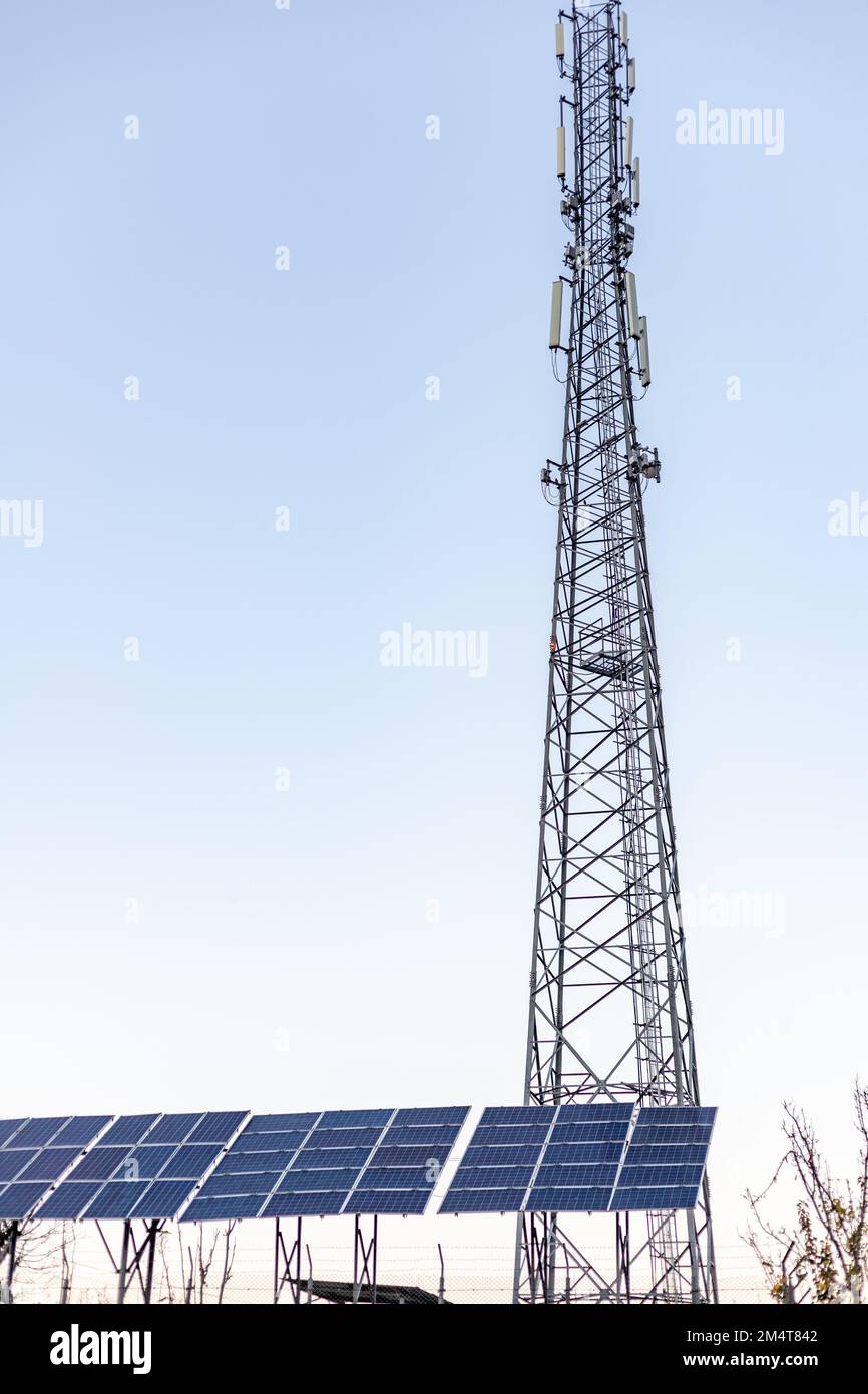 A cellular phone signal tower transmitter powered by solar panels Stock