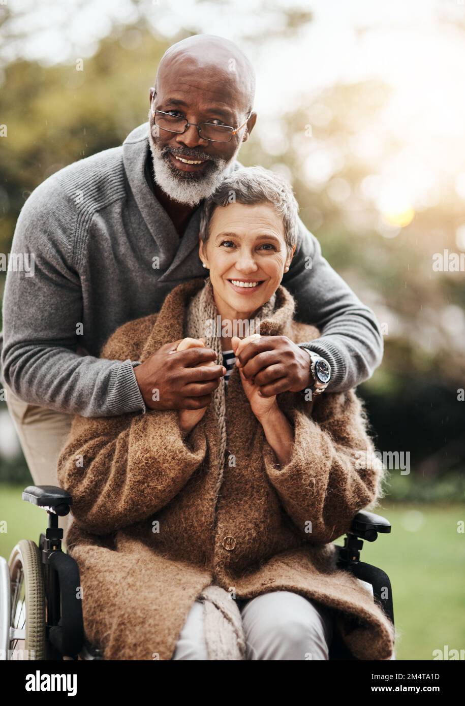 Hold those dearest to you very close. an elderly man pushing his