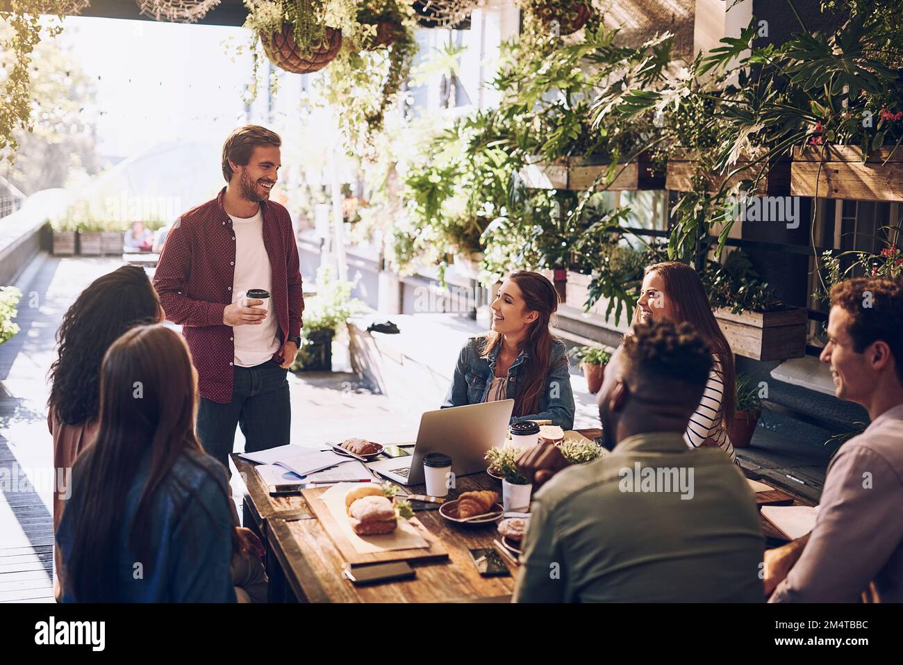 Discussing ideas over lunch. a group of creative workers having a