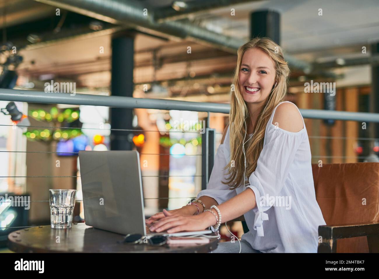 Thought Id try my hand at this whole blogging thing. Cropped portrait of an attractive young woman using her laptop while sitting in a cafe. Stock Photo