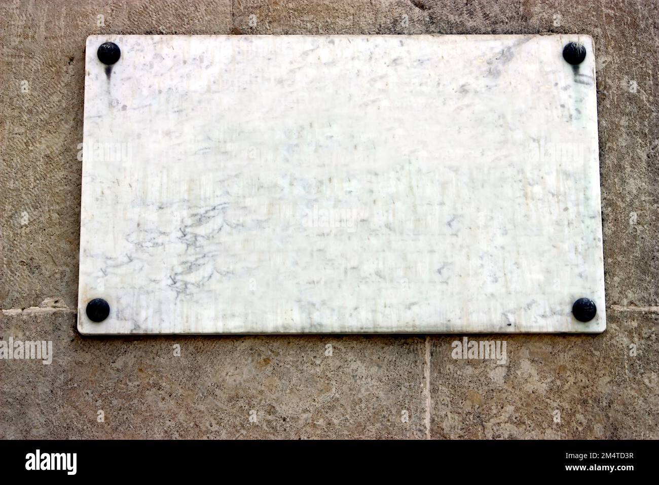 A plaque on the wall Stock Photo Alamy