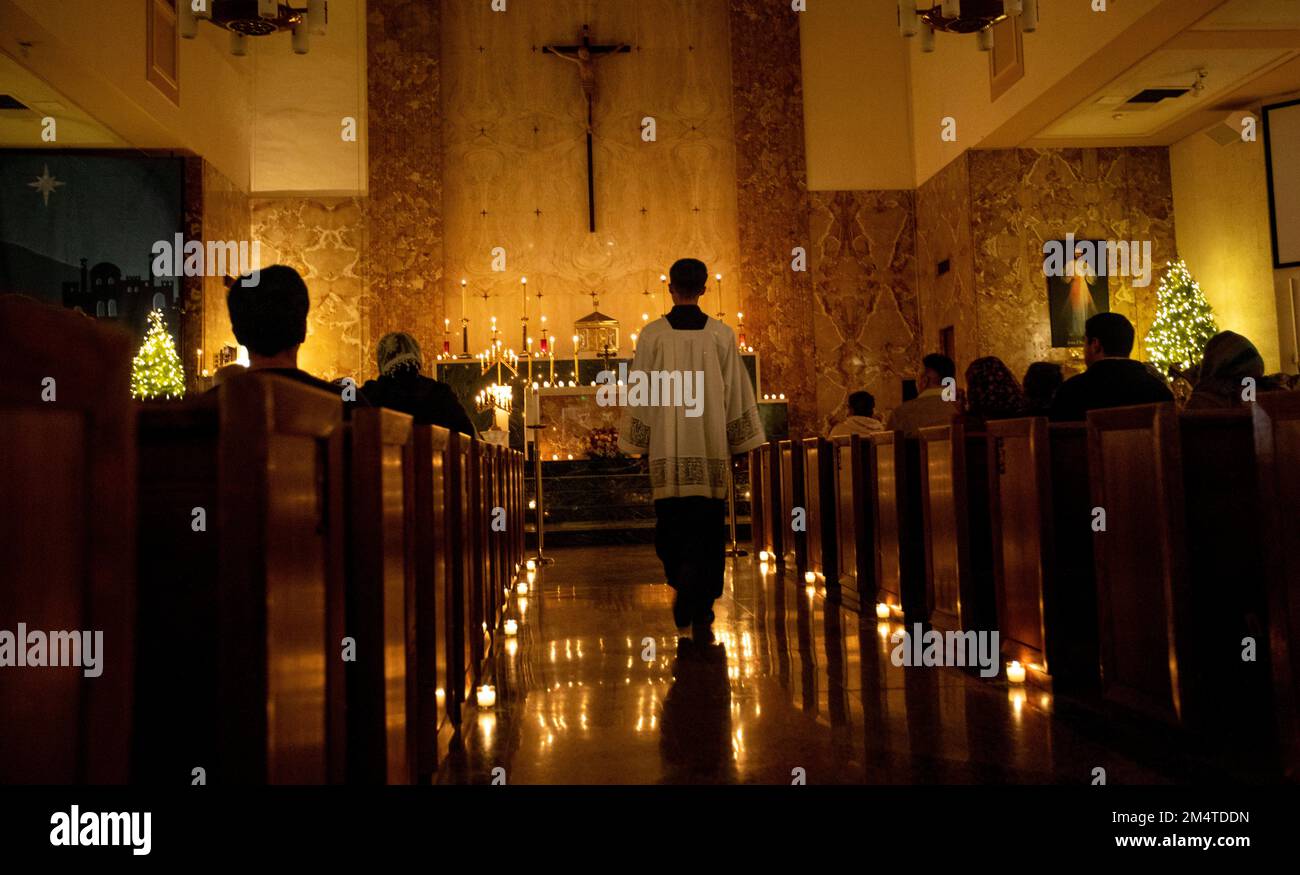 Los Angeles, California, USA. 22nd Dec, 2022. An altar server walks to