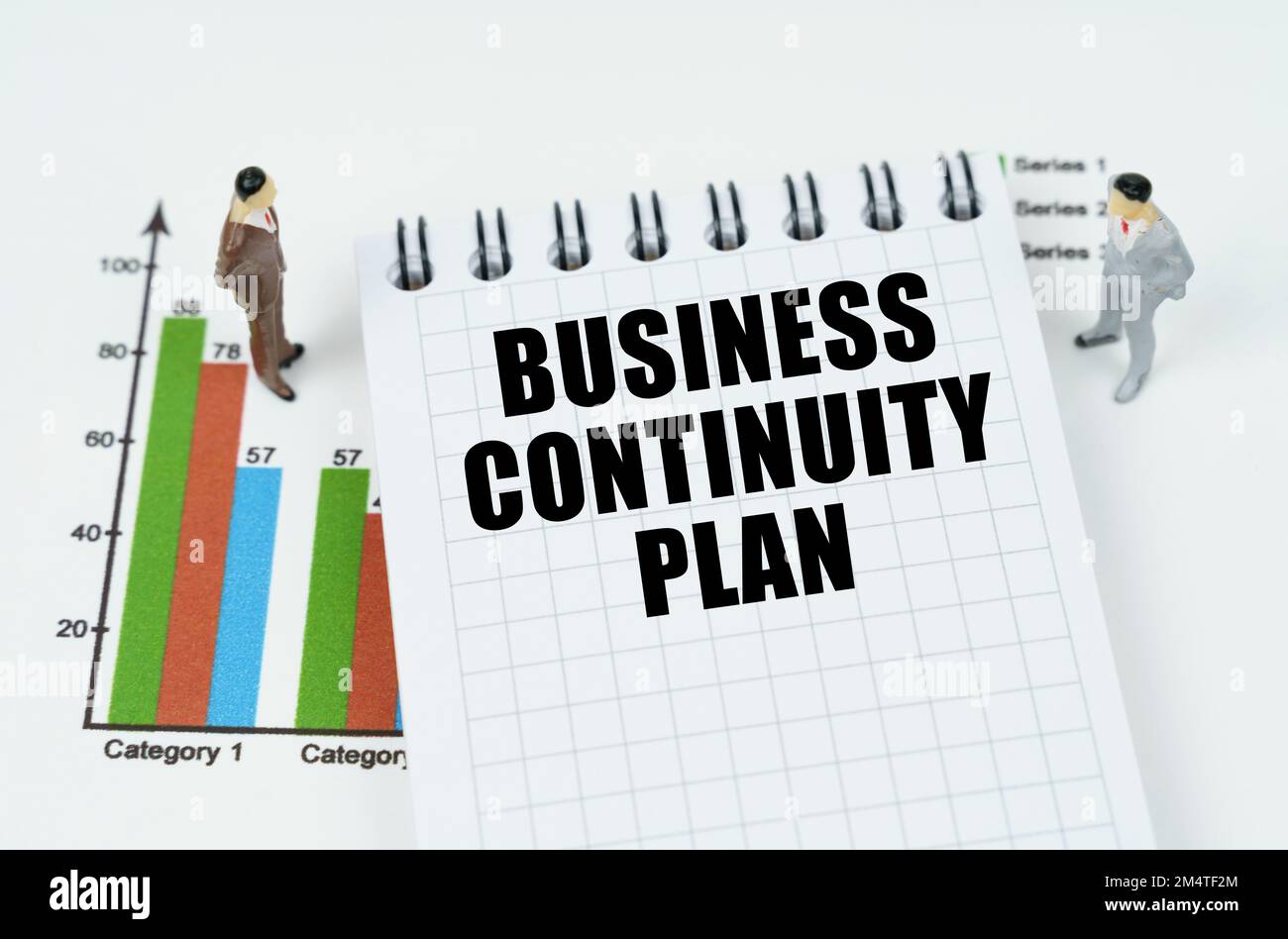 Business and finance concept. On the chart there are miniature figures ...