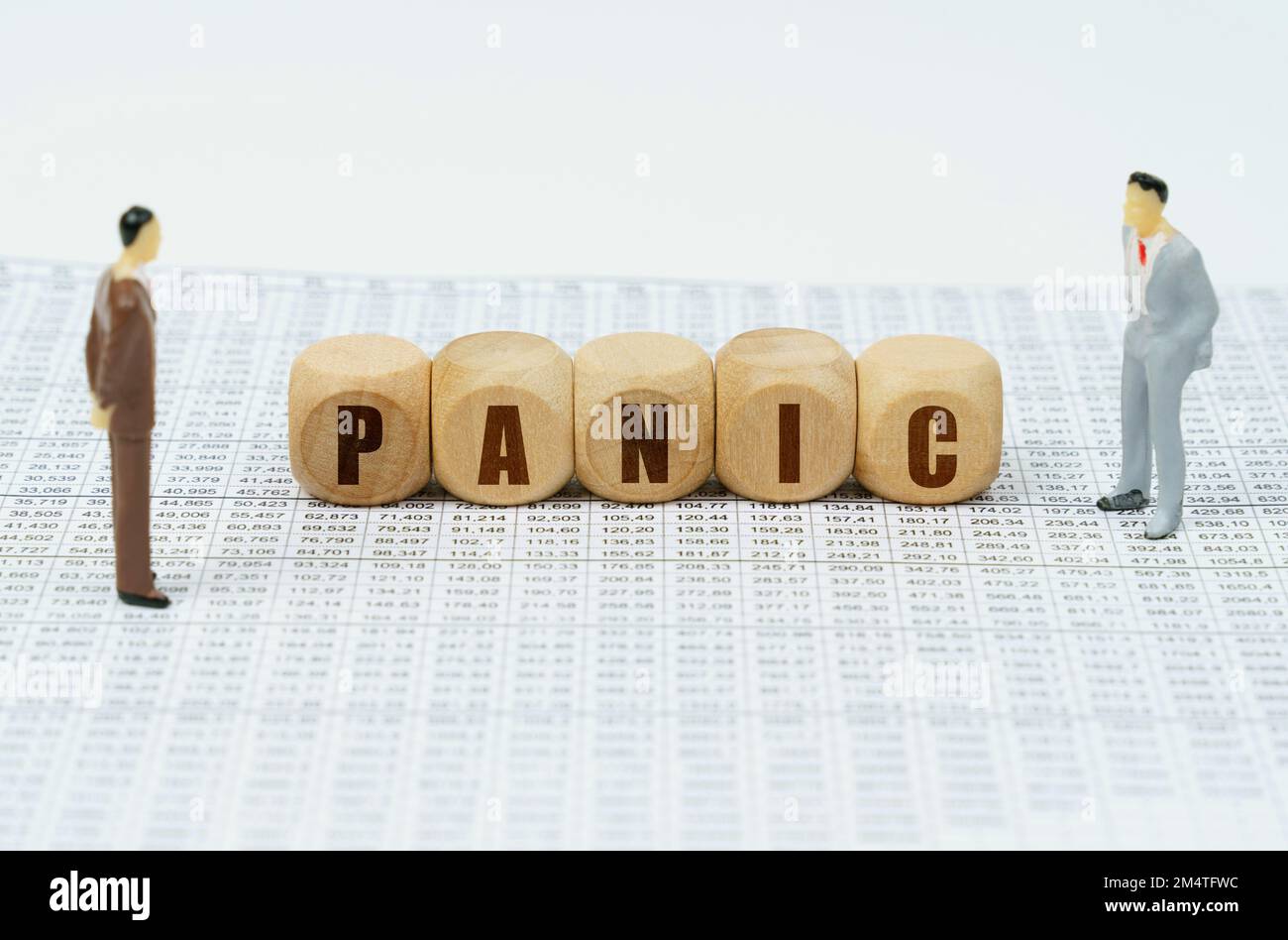 Business and finance concept. On financial reports there are figures of people and cubes with the inscription - PANIC Stock Photo