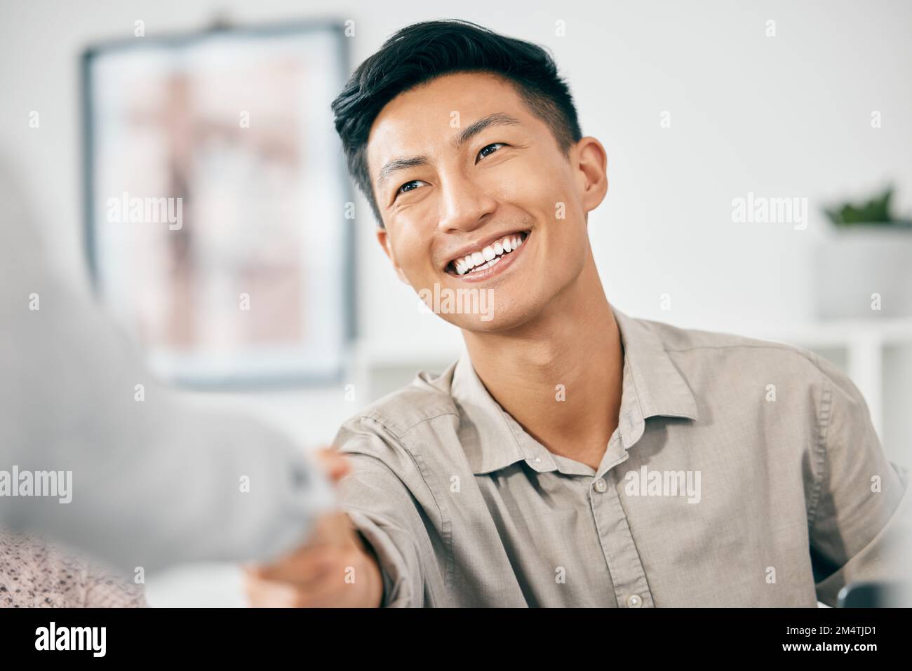 Asian executive, handshake and man in agreement, negotiation and smile for contract at modern