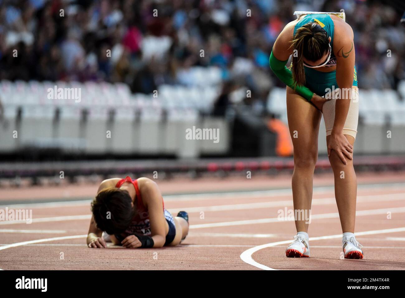 Torita Blake & Yuka Takamatsu drained after competing in the T38 400m