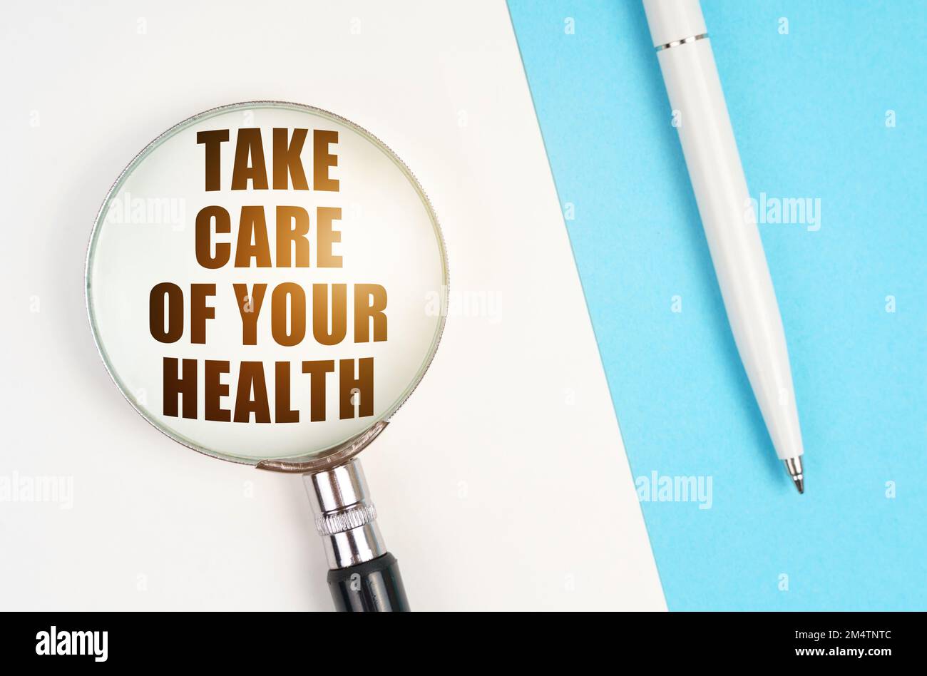 Medical concept. On a white blue surface are a pen and a magnifying