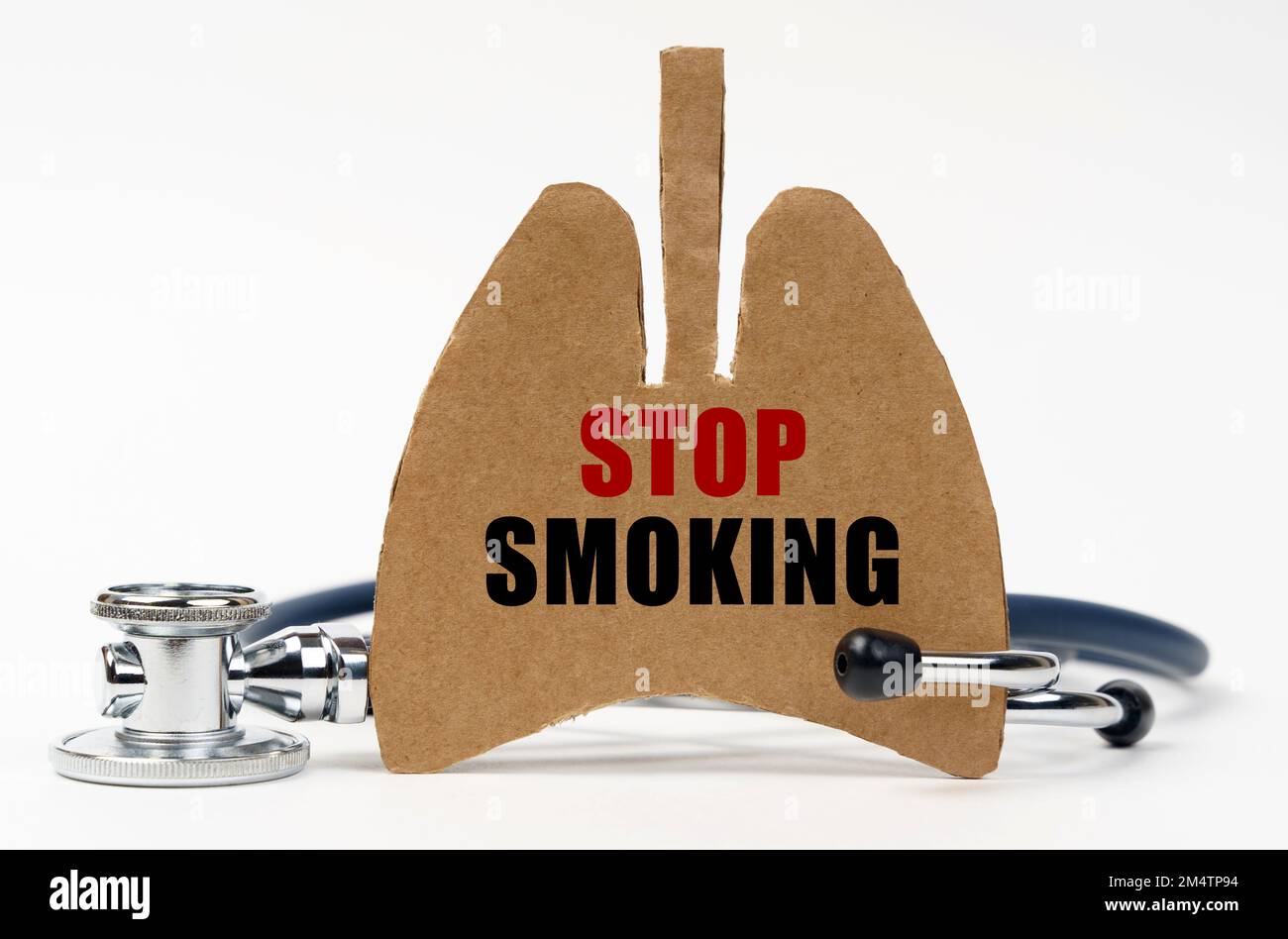 Medical concept. On a white surface are a stethoscope and a cardboard