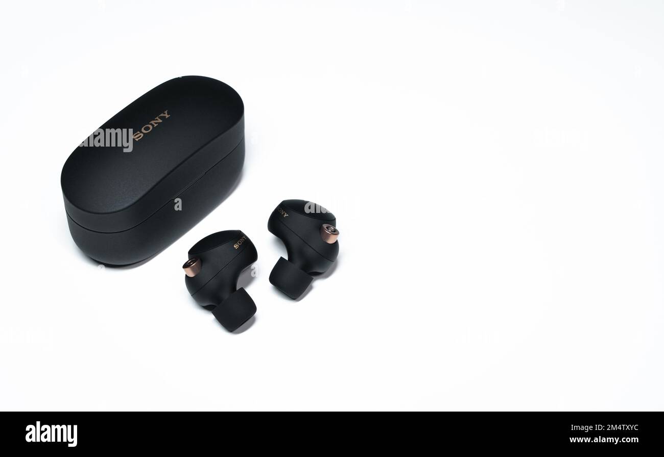 The Sony WF1000XM4 truly wireless headphones with charging case on