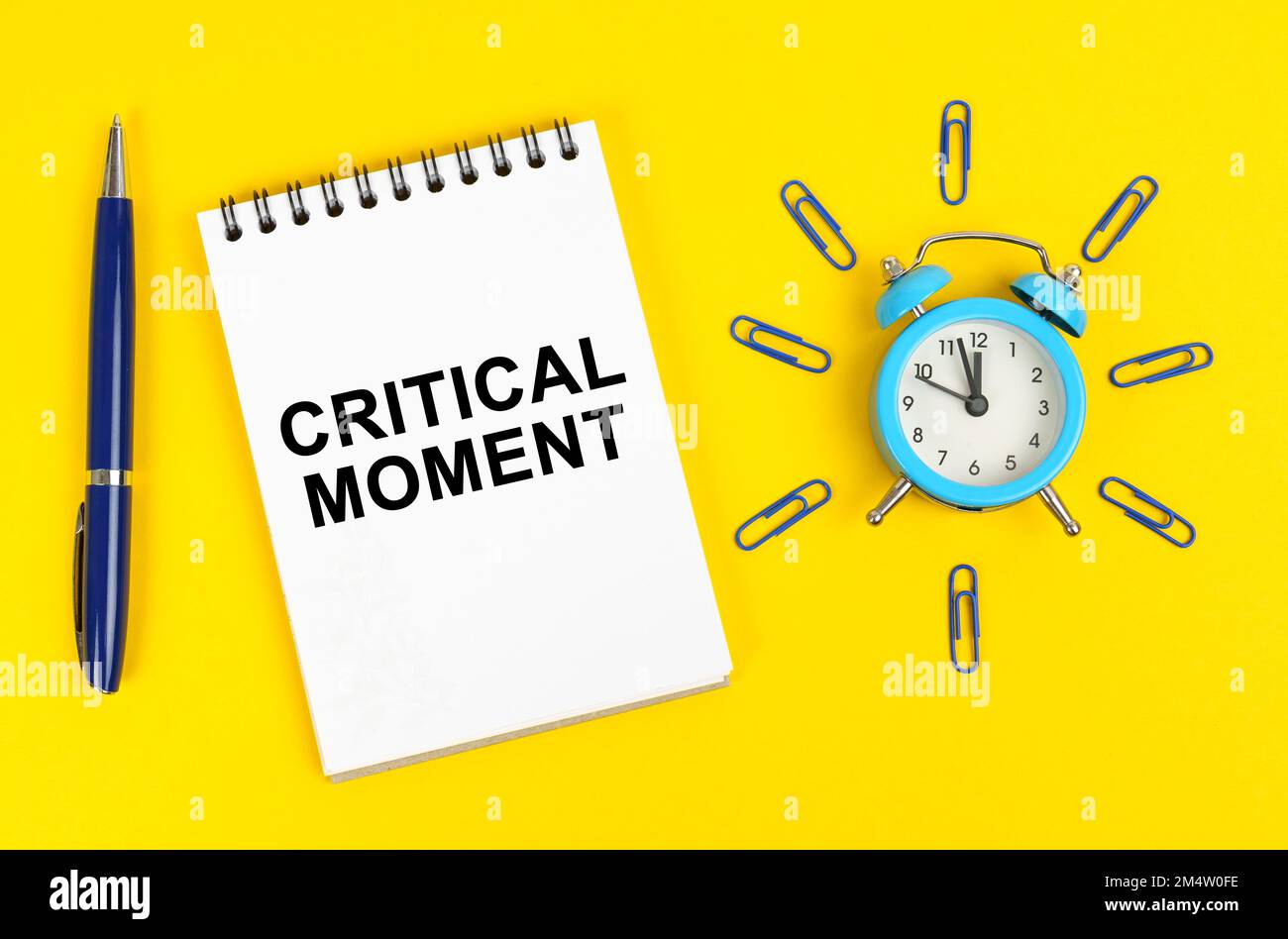 Business and technology concept. On a yellow surface there is an alarm ...