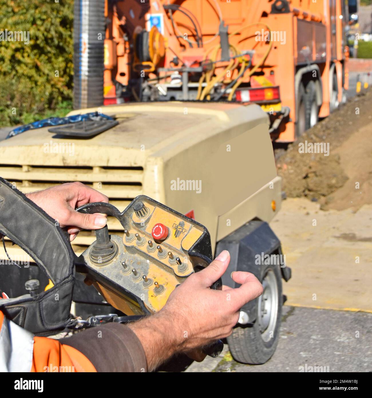 Close up hands of operator & driver on remote control unit working