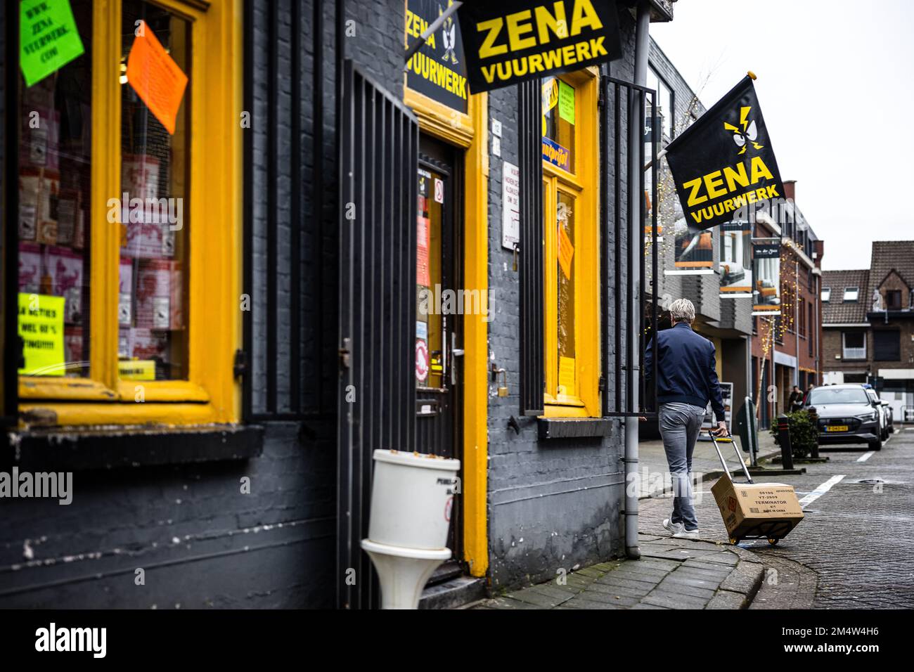 BAARLE-NASSAU - People with boxes of fireworks in the streets of the Dutch-Belgian enclave of Baarle-Nassau. Local residents complain about nuisance caused by large-scale fireworks sales. The village in the Belgian border region attracts many fireworks enthusiasts every year. ANP ROB ENGELAAR netherlands out - belgium out Stock Photo