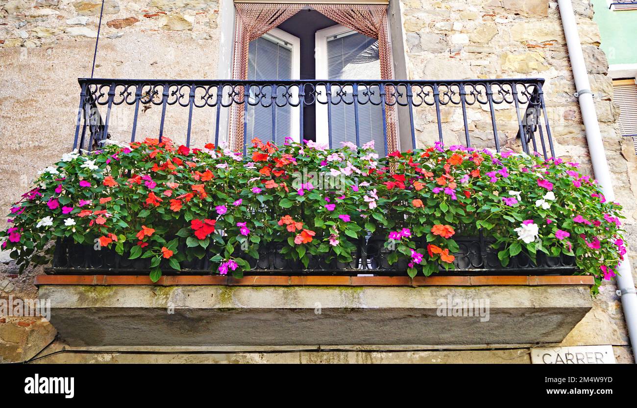Balcony with flowers in Castellar de N'hug in Girona, Catalonia, Spain, Europe Stock Photo