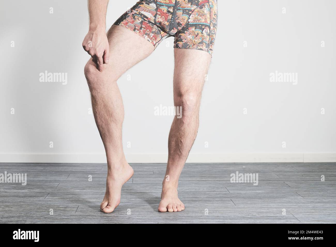 Male legs showing pain in knee Stock Photo
