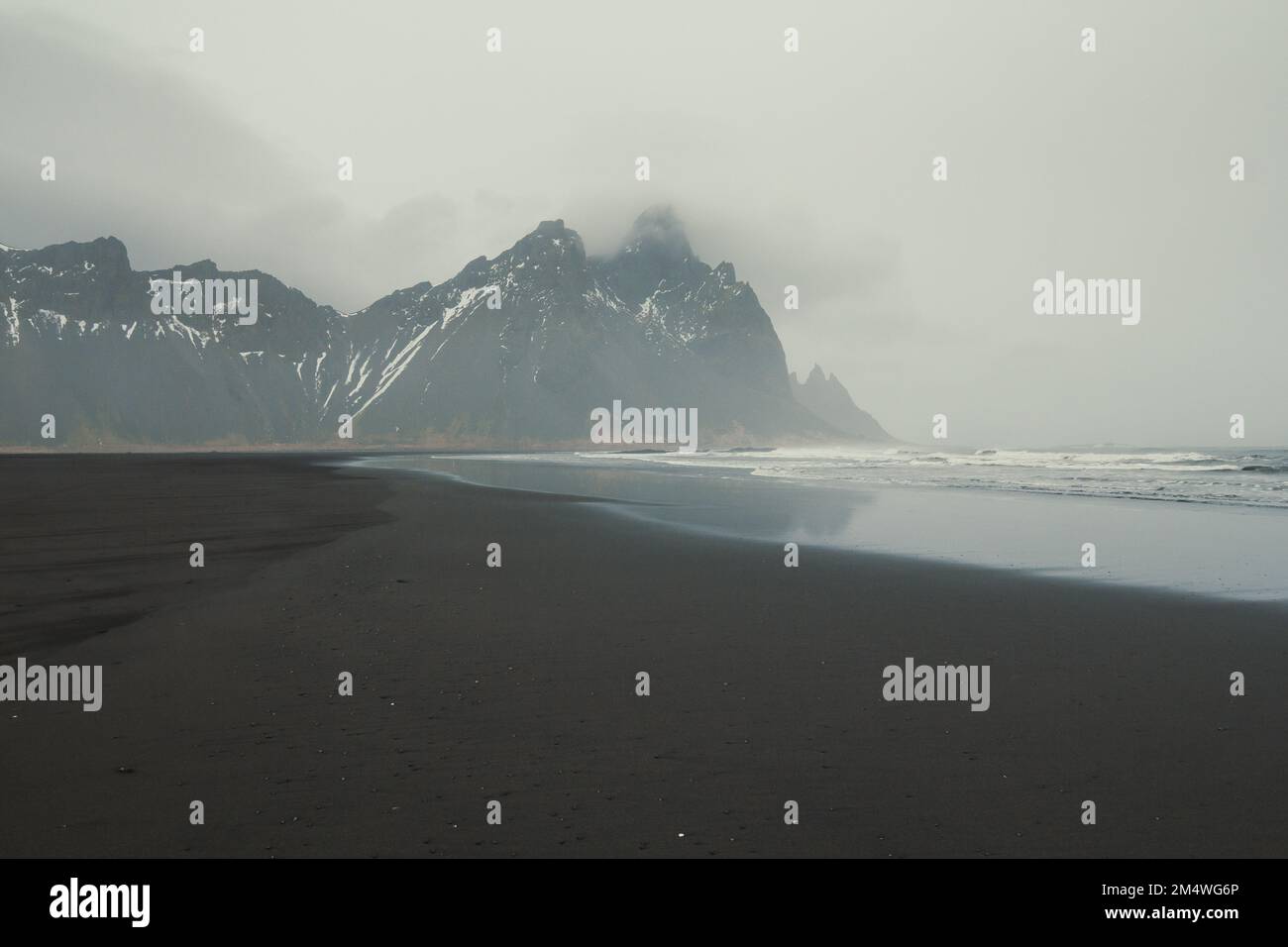 Wet surfline of black beach landscape photo Stock Photo