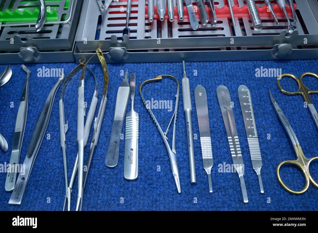 Dental surgical instruments, made by Unicorn, placed on a stand