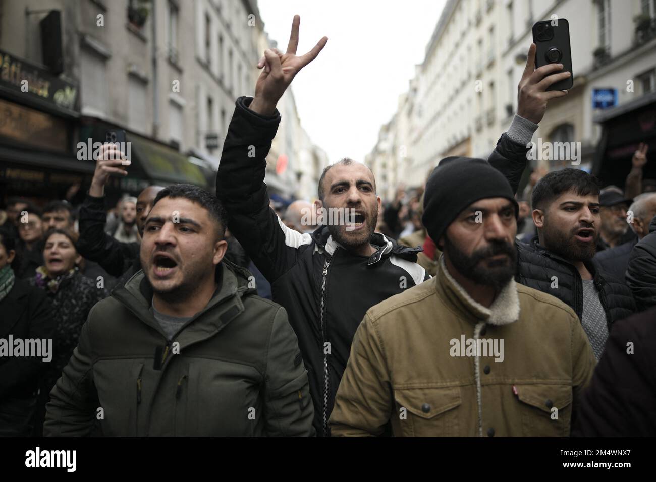 Paris, France. 23rd Dec, 2022. People shout slogans following a