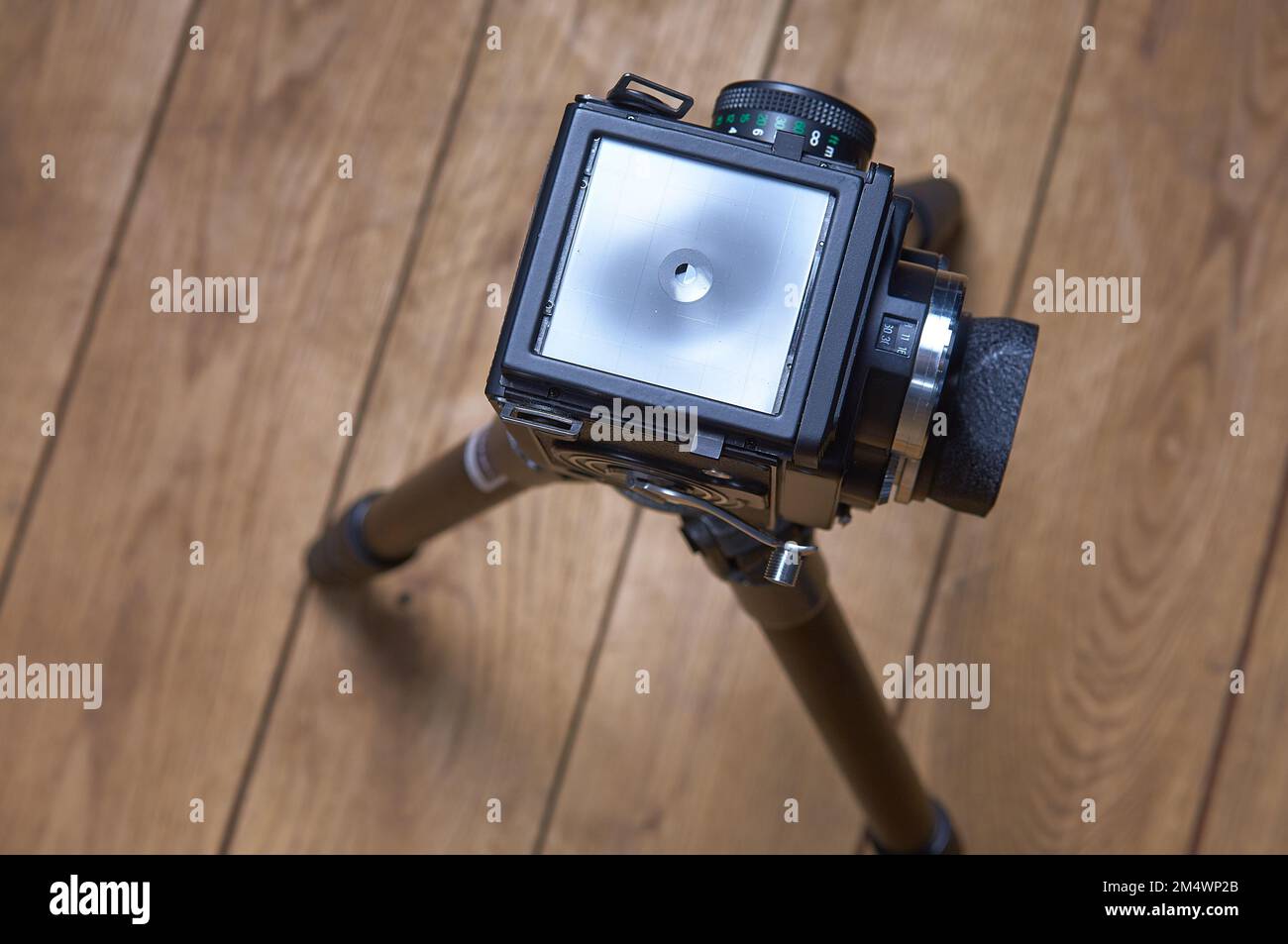 Old and vintage 6X6 or 120mm film camera on tripod. View from above