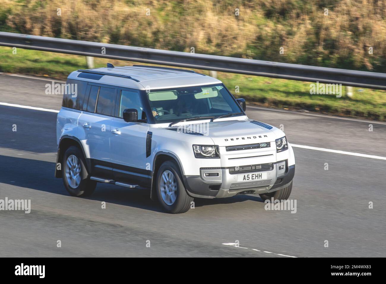 2022 White LAND ROVER DEFENDER HARD TOP SE D MHEV 2997cc Diesel Hybrid; travelling on the M6 motorway UK Stock Photo