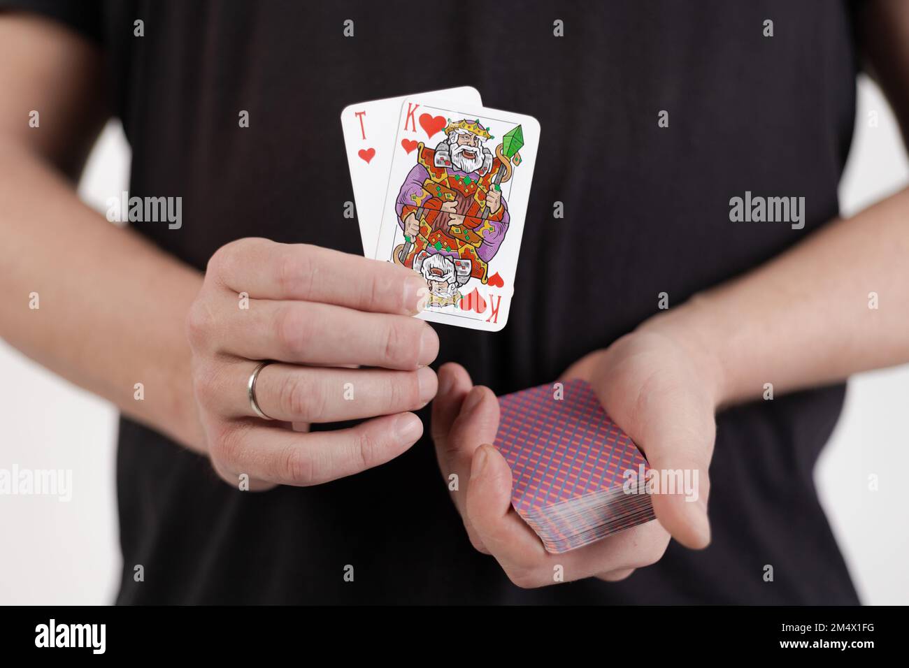 Male hands hold a deck of cards and show tricks Stock Photo - Alamy