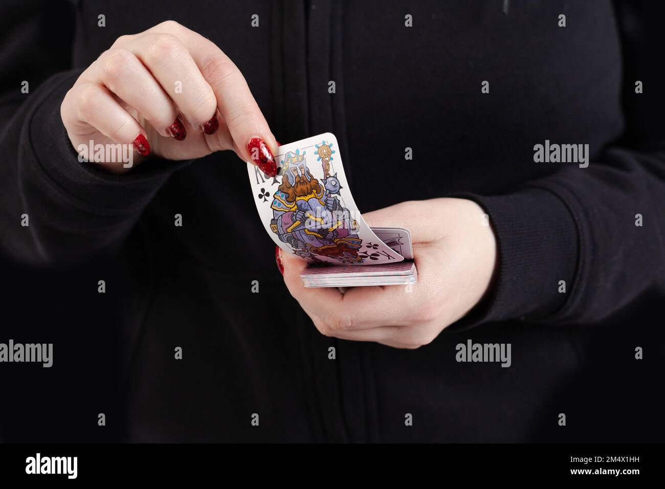 Female hands hold a deck of cards and show tricks Stock Photo - Alamy