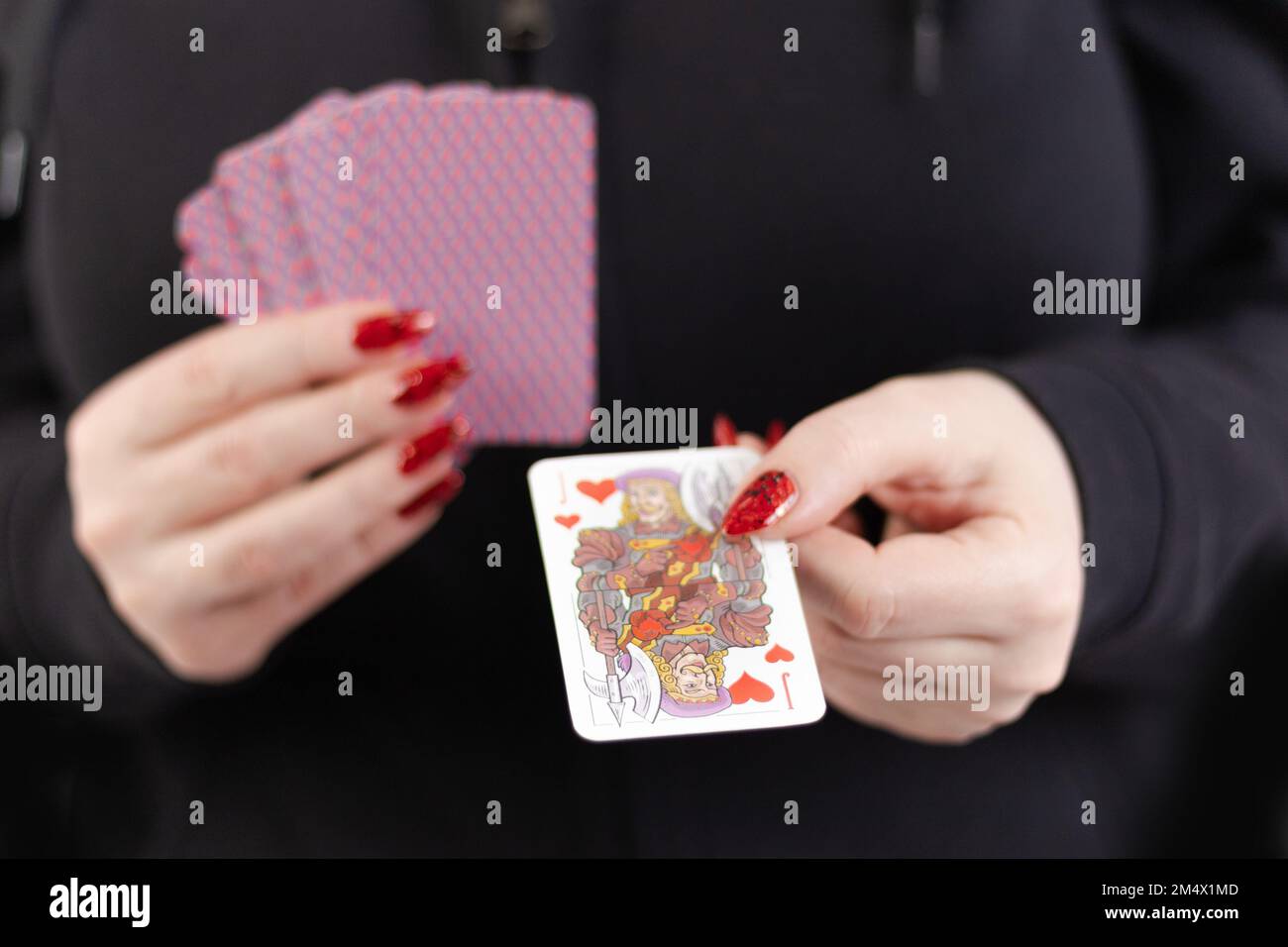 Female hands hold a deck of cards and show tricks Stock Photo - Alamy
