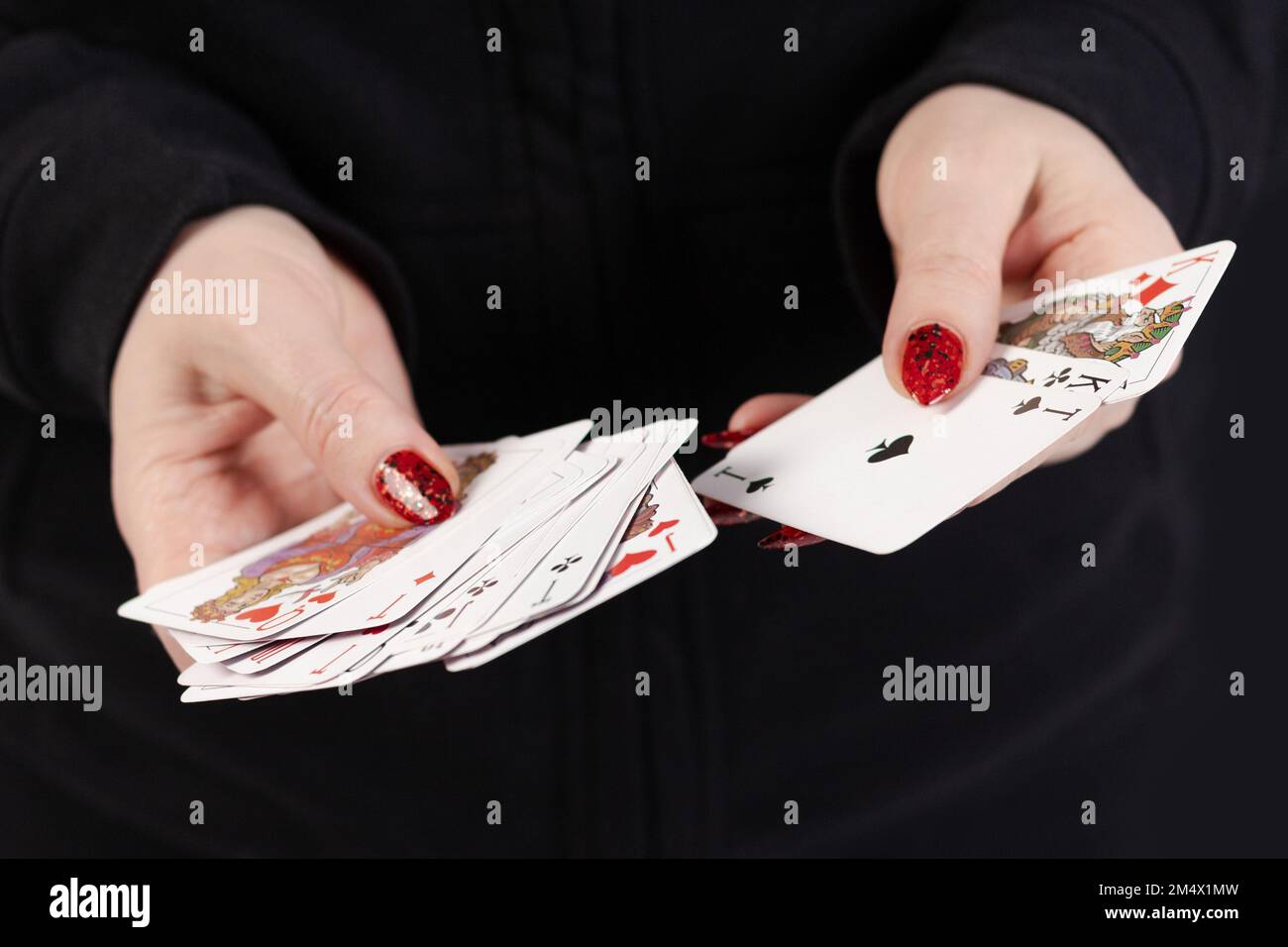 Female hands hold a deck of cards and show tricks Stock Photo - Alamy