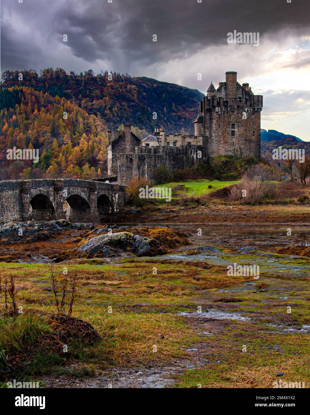 Portrait shot of Eilean Donan Castle at the mouth of Loch Duich on a stormy autumn day Stock Photo