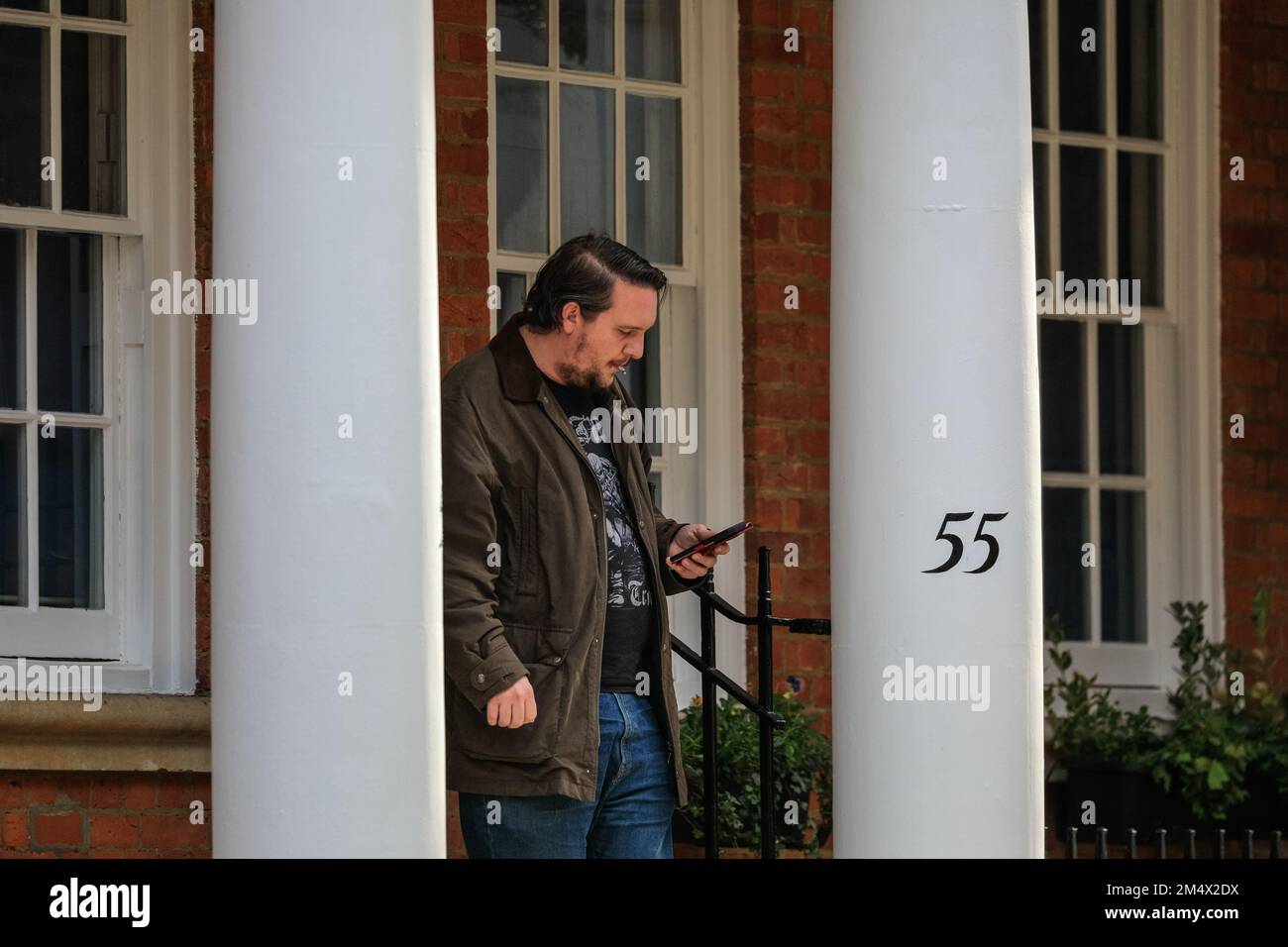 Man outside 55 Tufton Street, exterior view of town house