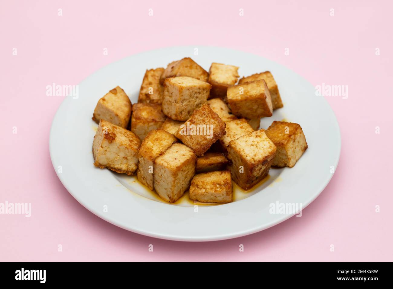 crispy deep stir fried tofu cubes on small white dish Stock Photo Alamy