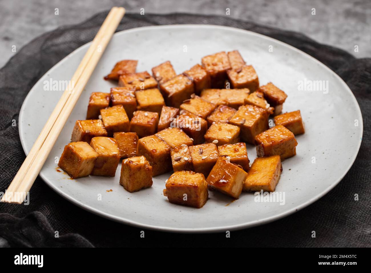 crispy deep stir fried tofu cubes on small white dish Stock Photo Alamy