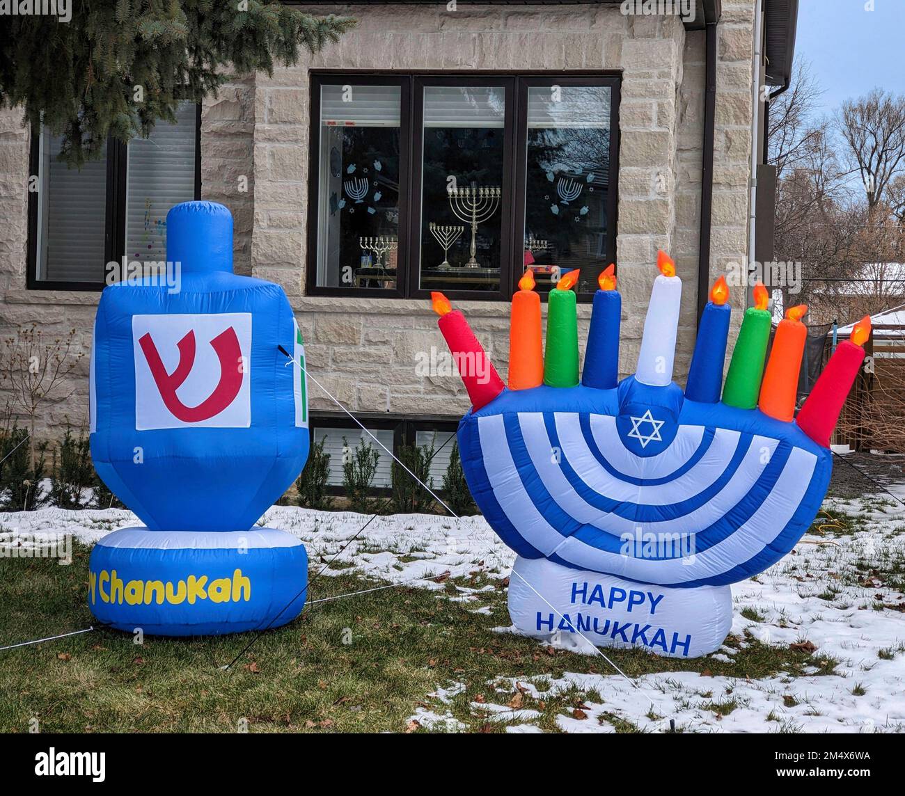 Inflatable decorations for Hanukkah in the front yard of a house Stock