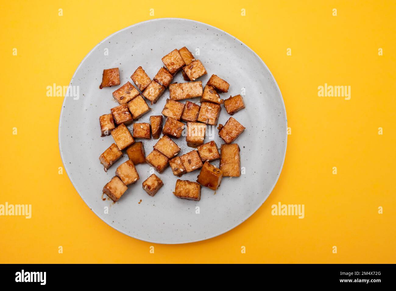 crispy deep stir fried tofu cubes on small white dish Stock Photo Alamy