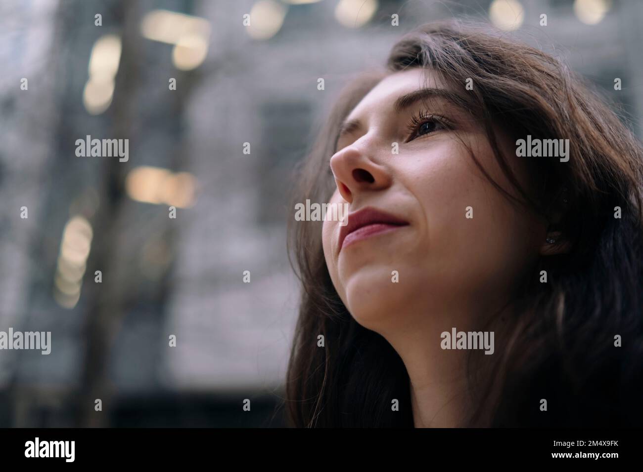 Thoughtful young woman with black hair Stock Photo