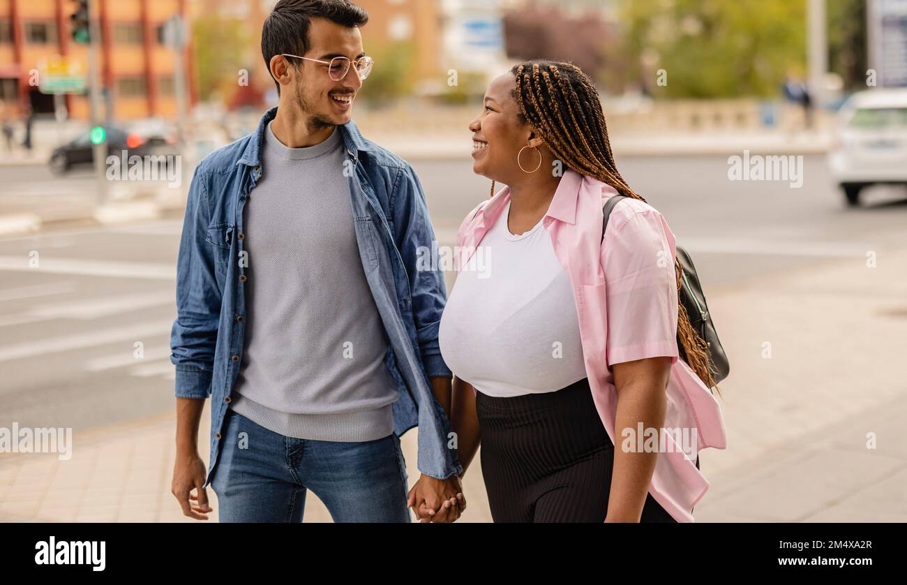 Diversity walking holding hands hi-res stock photography and images - Alamy