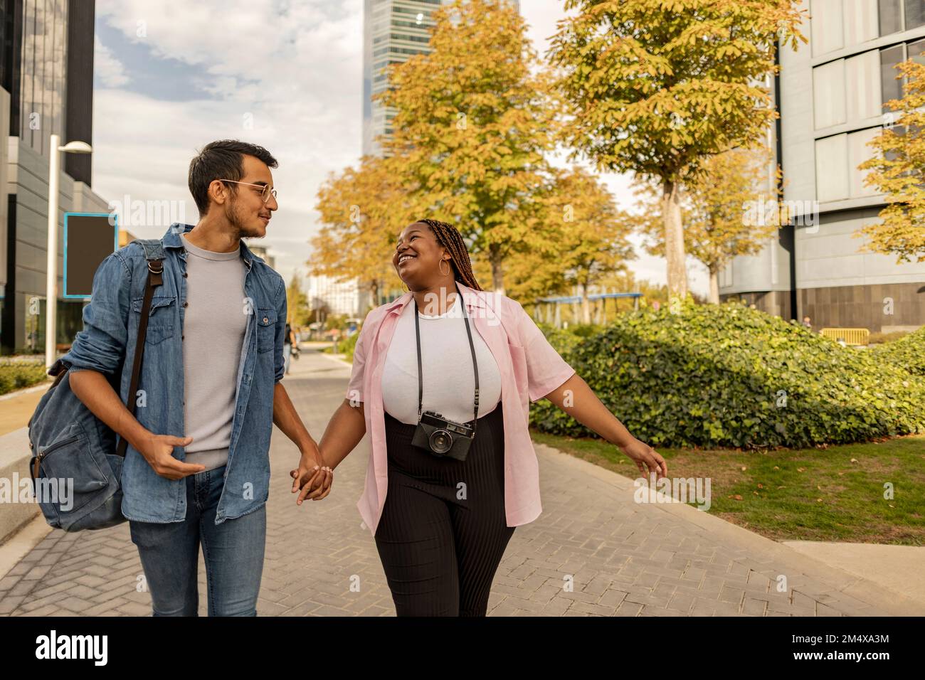 Diversity walking holding hands hi-res stock photography and images - Alamy