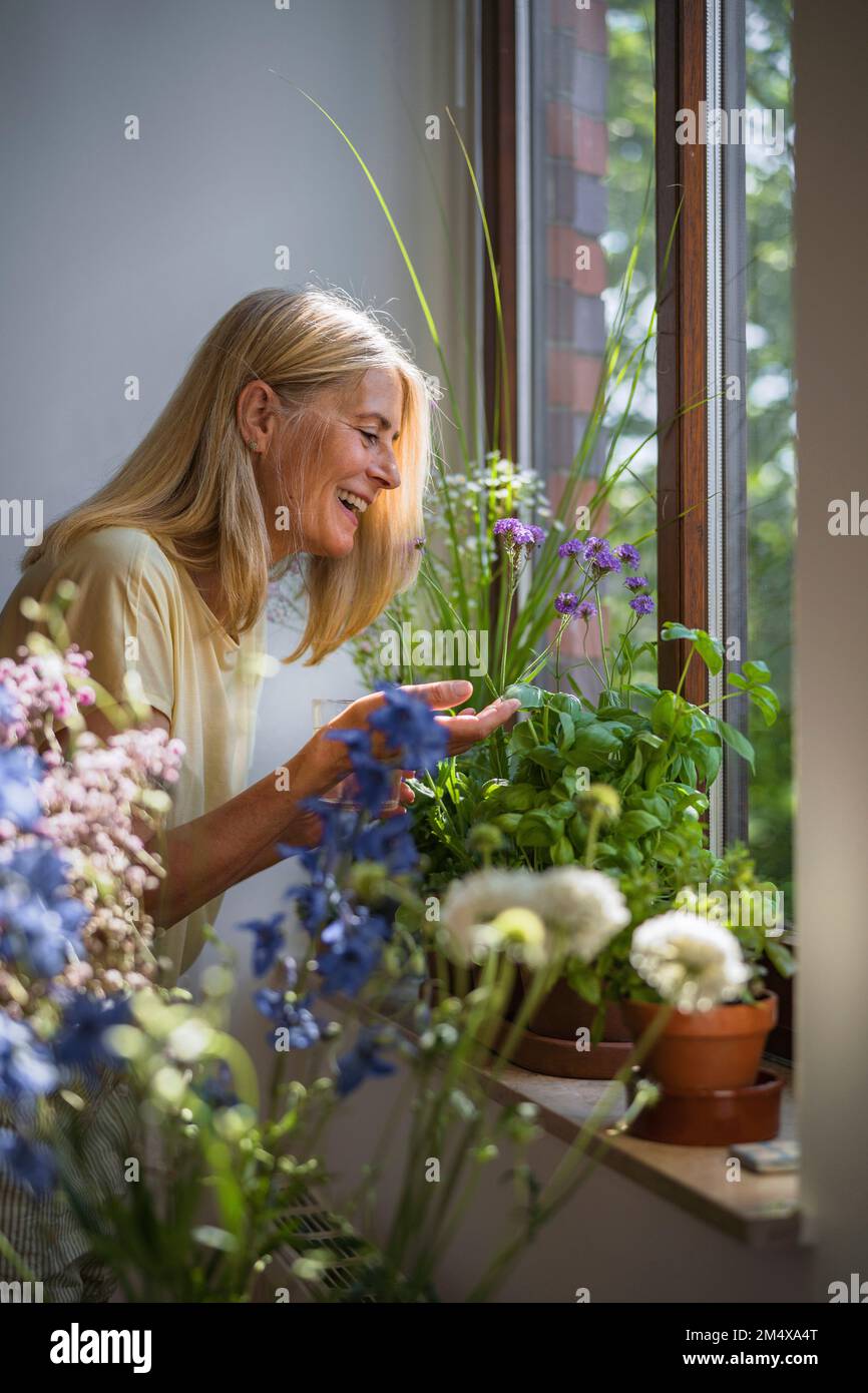 Cheerful mature woman green hi-res stock photography and images - Alamy