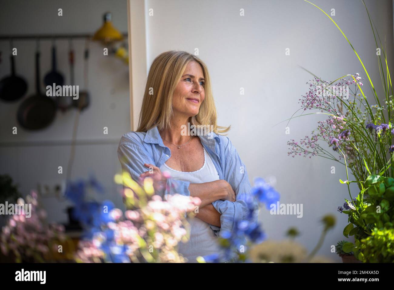 Thoughtful mature woman arms hi-res stock photography and images - Alamy