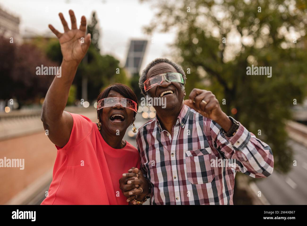 Smart couple holding hands hi-res stock photography and images - Alamy