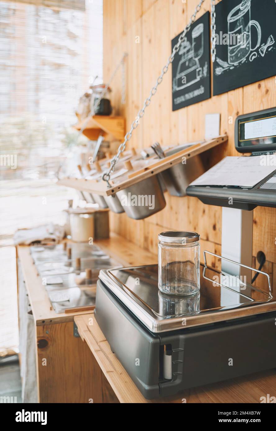 Empty jar on weight scale in zero waste shop Stock Photo Alamy