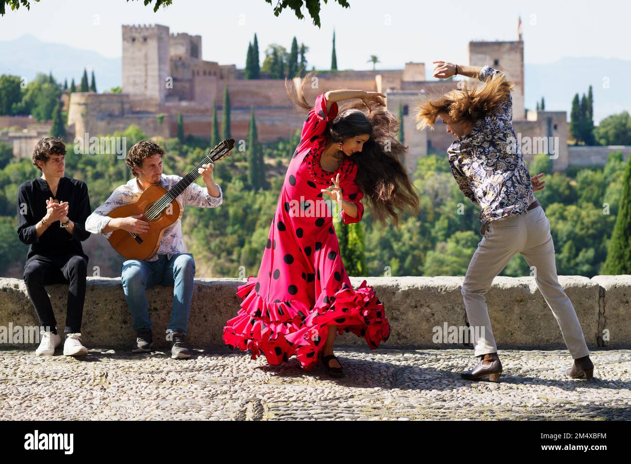 Musician and dancers performing flamenco at Alhambra, Granada, Spain Stock Photo