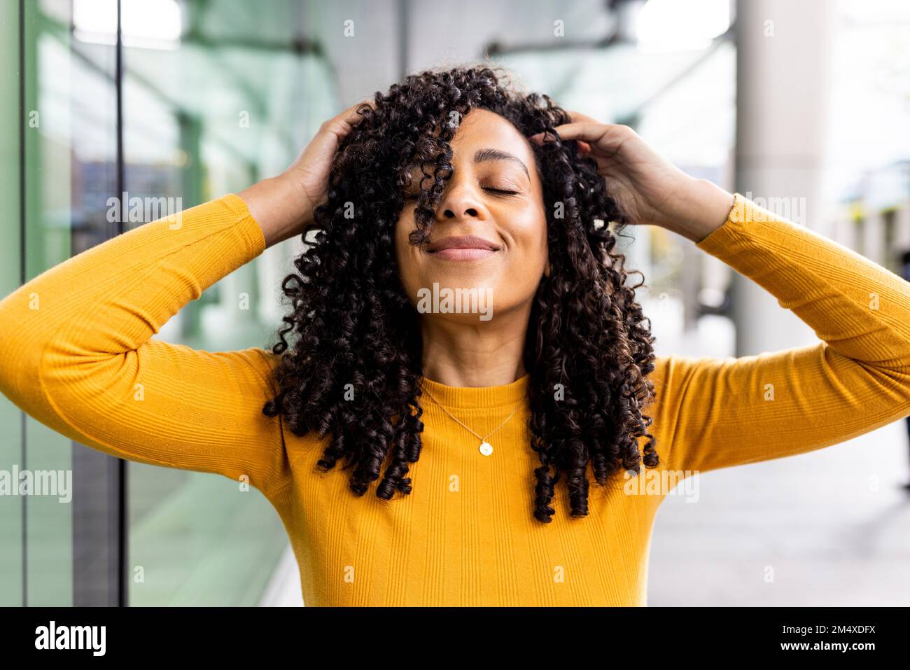 Woman raising hands head on hi-res stock photography and images - Alamy